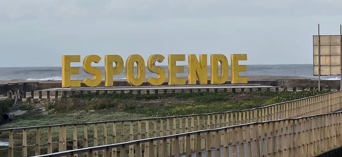 Large yellow ESPOSENDE letters by the sea