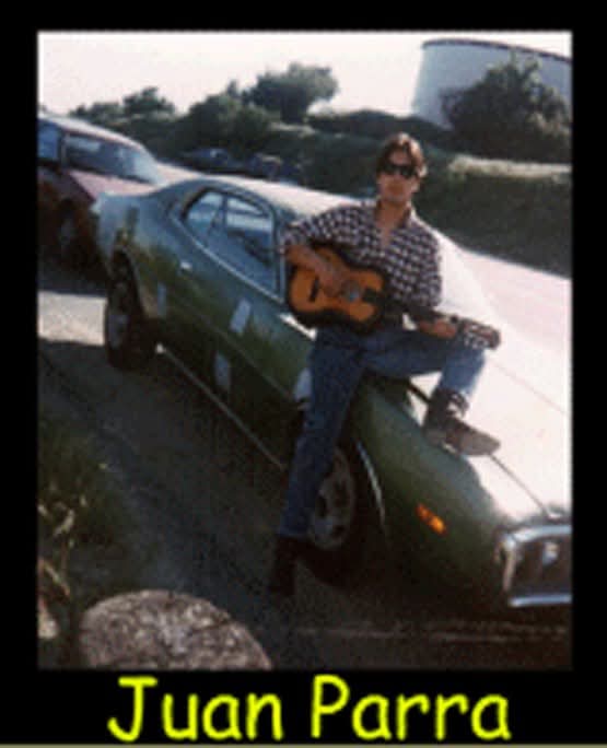 Juan Parra in high school, with a guitar